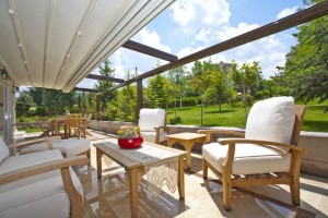 Retractable Roofing on balcony in large estate