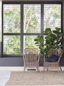 Dark Brown Plantation Shutters in Sitting Area - open