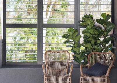 Dark Brown Plantation Shutters in Sitting Area - open