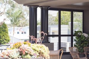 Dark Brown Plantation Shutters in Sitting Area - open