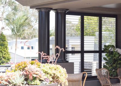 Dark Brown Plantation Shutters in Sitting Area - open