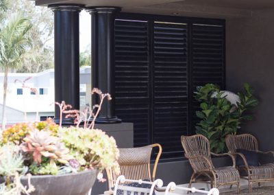 Dark Brown Plantation Shutters in Sitting Area - closed