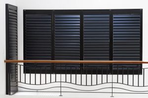 Plantation Shutters Closed on Stair Rail Window